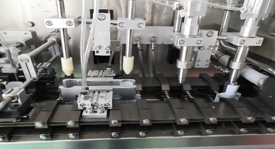 Dispositivo especial personalizado de abertura e sopro de saco, enchimento de cabe&ccedil;a dupla更有效开袋吹气装置、双头灌装